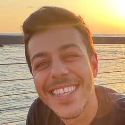 Mert, smiling.